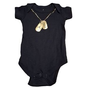 Pre owned Black  and Gold Jordan onesie 0-6 months